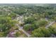 Wide aerial view of a residential area featuring homes with pools and lush landscaping, offering a peaceful environment at 4085 Se 23Rd Ter, Ocala, FL 34480