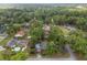 Overhead shot displays the neighborhood's well-maintained homes, swimming pools, and lush greenery, creating a scenic landscape at 4085 Se 23Rd Ter, Ocala, FL 34480