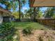 Private backyard space with a brick-lined area and a well-maintained lawn, offering a serene outdoor setting at 4085 Se 23Rd Ter, Ocala, FL 34480