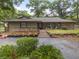 Charming single-story home with stone accents, landscaped garden beds, and a welcoming front porch at 4085 Se 23Rd Ter, Ocala, FL 34480