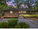 Charming single-story home with stone accents, landscaped garden beds, and a welcoming front porch at 4085 Se 23Rd Ter, Ocala, FL 34480