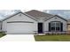 Charming single-Gathering home with a well-manicured lawn, two car garage, and inviting front entrance at 4723 Sw 88Th Ln, Ocala, FL 34476