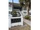 Exterior of residential building with stairs leading to upper level and nearby community signage at 8142 Fairways Cir # S204, Ocala, FL 34472