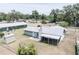 An aerial view showcases this property's backyard, complete with a lanai and storage shed at 3990 Se 20Th Ct, Ocala, FL 34480