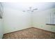 Empty bedroom featuring large windows and a ceiling fan at 3990 Se 20Th Ct, Ocala, FL 34480