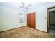 Bedroom with neutral walls and carpet, closet, and a window with natural light at 3990 Se 20Th Ct, Ocala, FL 34480