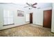 Bedroom featuring large windows and a ceiling fan at 3990 Se 20Th Ct, Ocala, FL 34480