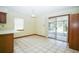 Bright breakfast nook with sliding glass doors leading to the screened lanai at 3990 Se 20Th Ct, Ocala, FL 34480