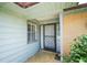 Inviting front porch featuring a decorative door, brick accents, and ample natural light at 3990 Se 20Th Ct, Ocala, FL 34480