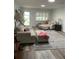 Cozy living room filled with bright sunlight, soft seating, and wood-look floors at 8533 Sw 93Rd Pl # A, Ocala, FL 34481
