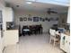 Open dining area adjacent to the kitchen with a table and a set of chairs at 8665 Sw 94Th St # C, Ocala, FL 34481