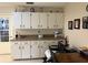 Dining area with built-in cabinets, providing ample storage space and counter area at 8665 Sw 94Th St # C, Ocala, FL 34481