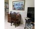 Small office area with a desk, chair, and painting on the wall at 8665 Sw 94Th St # C, Ocala, FL 34481