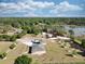 Spacious grounds, beautiful landscape, and green lawn in this aerial view of the residence at 11395 Se 108Th Terrace Rd, Belleview, FL 34420
