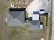 Aerial view of a home displaying the roof, carport, driveways, and surrounding landscaping at 11395 Se 108Th Terrace Rd, Belleview, FL 34420