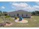 Picturesque backyard featuring an exterior patio, and expansive lawn space perfect for entertainment at 11395 Se 108Th Terrace Rd, Belleview, FL 34420
