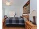 Bright bedroom featuring a log bed, wood floors, and deer-themed decor at 11395 Se 108Th Terrace Rd, Belleview, FL 34420