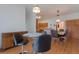 Dining area with laminate floors, counter seating and classic chandelier at 11395 Se 108Th Terrace Rd, Belleview, FL 34420