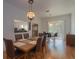 Spacious dining area with laminate flooring and views into living room at 11395 Se 108Th Terrace Rd, Belleview, FL 34420