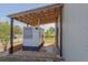 Generac generator sits on a gravel pad under a covered metal awning on the side of the home at 11395 Se 108Th Terrace Rd, Belleview, FL 34420