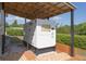 Close up of the Generac Generator under a covered metal awning on the side of the home at 11395 Se 108Th Terrace Rd, Belleview, FL 34420