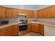 Efficient kitchen featuring stainless appliances, light countertops and light wood cabinets at 11395 Se 108Th Terrace Rd, Belleview, FL 34420