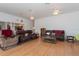 Inviting living room features laminate floors and comfortable seating at 11395 Se 108Th Terrace Rd, Belleview, FL 34420