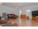 Bright and spacious living room with laminate floors and large windows at 11395 Se 108Th Terrace Rd, Belleview, FL 34420