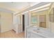 Bathroom featuring double sinks, tile floor, and a view of the tub and shower at 11427 Sw 82Nd Ave, Ocala, FL 34481