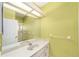 Well-lit bathroom featuring a vanity with a white countertop and a large mirror at 11427 Sw 82Nd Ave, Ocala, FL 34481