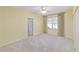 Bedroom with neutral carpet, ceiling fan, and a single window at 11427 Sw 82Nd Ave, Ocala, FL 34481