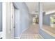 Welcoming foyer with tile flooring leading into a carpeted living space at 11427 Sw 82Nd Ave, Ocala, FL 34481