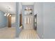 Welcoming foyer featuring tile flooring, a chandelier, and a spacious entryway at 11427 Sw 82Nd Ave, Ocala, FL 34481