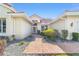 Inviting entrance with a brick walkway and manicured landscaping at 11427 Sw 82Nd Ave, Ocala, FL 34481