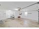 Spacious garage with white walls, concrete floor, window, and plenty of storage at 11427 Sw 82Nd Ave, Ocala, FL 34481