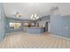 Spacious open-concept kitchen featuring neutral cabinets, tile floor, and ample natural light at 11427 Sw 82Nd Ave, Ocala, FL 34481