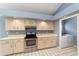 Functional kitchen with light wood cabinets, and stainless steel appliances at 11427 Sw 82Nd Ave, Ocala, FL 34481