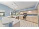 Spacious kitchen with tiled flooring, breakfast bar, and stainless steel appliances at 11427 Sw 82Nd Ave, Ocala, FL 34481