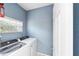 Laundry room with a washer and dryer and a window above at 11427 Sw 82Nd Ave, Ocala, FL 34481