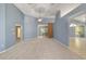 Bright living room featuring carpet floors, a ceiling fan, and a sliding glass door at 11427 Sw 82Nd Ave, Ocala, FL 34481