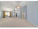 Spacious living room with high ceilings, carpet floors, and ample natural light at 11427 Sw 82Nd Ave, Ocala, FL 34481