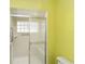 Bright shower stall with sliding glass door and a handicap assist bar at 11427 Sw 82Nd Ave, Ocala, FL 34481