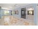 The sunroom boasts tile floors, multiple ceiling fans, and access to other rooms in the home at 11427 Sw 82Nd Ave, Ocala, FL 34481