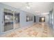 Tiled sunroom featuring abundant natural light from the many windows and sliding glass doors at 11427 Sw 82Nd Ave, Ocala, FL 34481