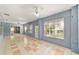A sunroom with tiled floors, lots of windows, and ceiling fans is great for entertaining at 11427 Sw 82Nd Ave, Ocala, FL 34481