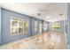 The sunroom is bright with lots of natural light, tile floors, and multiple ceiling fans at 11427 Sw 82Nd Ave, Ocala, FL 34481