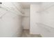 Walk-in closet featuring wire shelving and neutral carpet at 11427 Sw 82Nd Ave, Ocala, FL 34481
