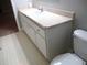 Bathroom featuring a vanity with ample storage and neutral countertops at 11495 Sw 138Th Ln, Dunnellon, FL 34432