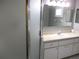 Bathroom featuring a vanity with a sink, mirror, and glass shower door at 11495 Sw 138Th Ln, Dunnellon, FL 34432