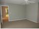 Spacious bedroom features a ceiling fan and neutral carpeting and paint at 11495 Sw 138Th Ln, Dunnellon, FL 34432